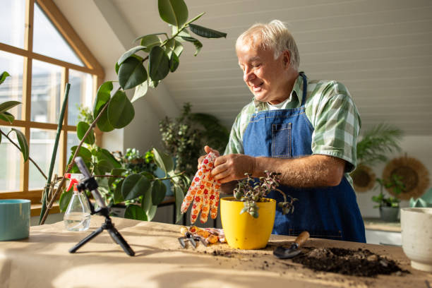 istock Senior man vlogging on gardening 1909868432