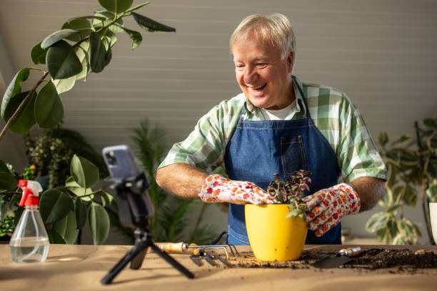 istock Senior man vlogging on gardening 1909868973
