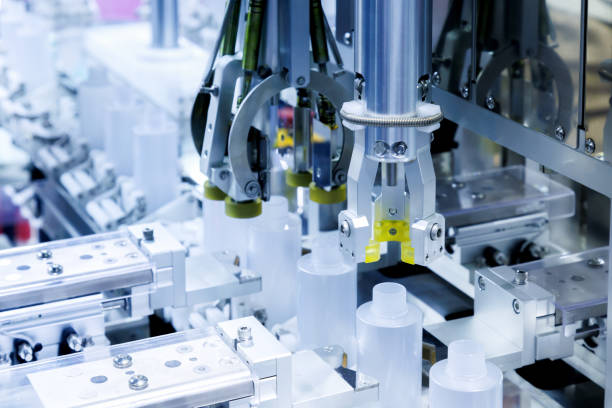 istock robot arm moving plastic bottle to conveyor belt of auto capping and labeling machine at cosmetic and skin care manufacturing. cosmetic industry and ai technology machinery concept. 1909887957