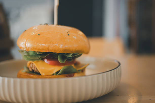 istock Fresh tasty burger in fast food cafe 1909907393