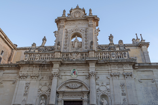 Stone carved decoration in Baroque style on the facade. Lecce, Puglia, Italy