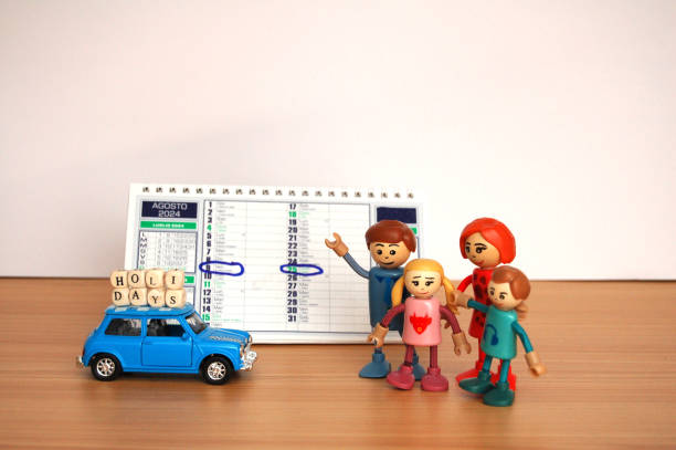 toy family goes on vacation in August with their blue mini car
