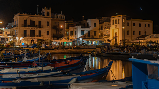 Mondello Beach - Palermo - Italy - June 14, 2023. Little Colored Boats Moored In The Little port Of Mondello, Illuminated At Night On Blurred Background