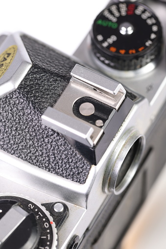 Old retro film camera on a white background showing the flash Hot-shoe