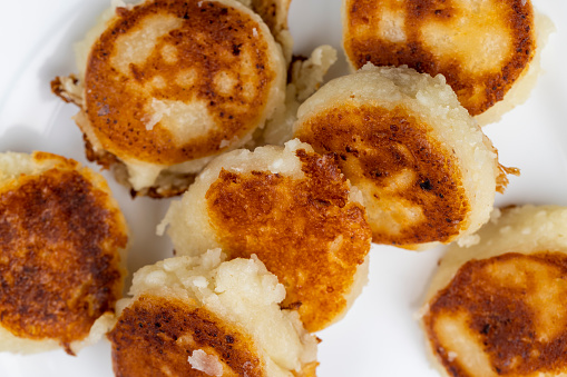 homemade small cheesecakes pancakes close-up, made from cottage cheese cheese pancakes with sour cream