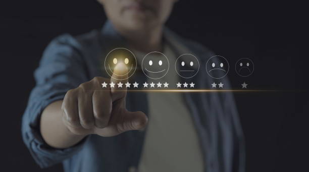 istock Businessman pressing smiley face emoticon on virtual touch screen. Customer service evaluation concept. 1909968685