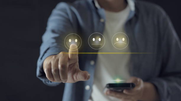 istock Businessman pressing smiley face emoticon on virtual touch screen. Customer service evaluation concept. 1909968686