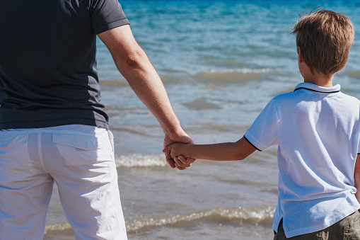 Shot of a young family enjoying a day at the beach