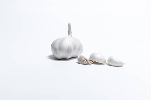 Garlic on white backgroung, raw, healthy food with copy space