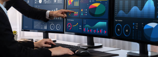 istock Analyst working on BI dashboard on computer monitor. Trailblazing 1910011242