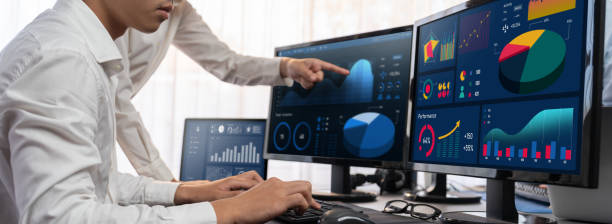 istock Analyst working on BI dashboard on computer monitor. Trailblazing 1910015901