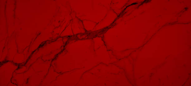 istock abstract creative pattern of red marble stone ceramic for graphic design. red carrara marble with beautiful black stone veins. marble texture of stone for decoration. 1910017476