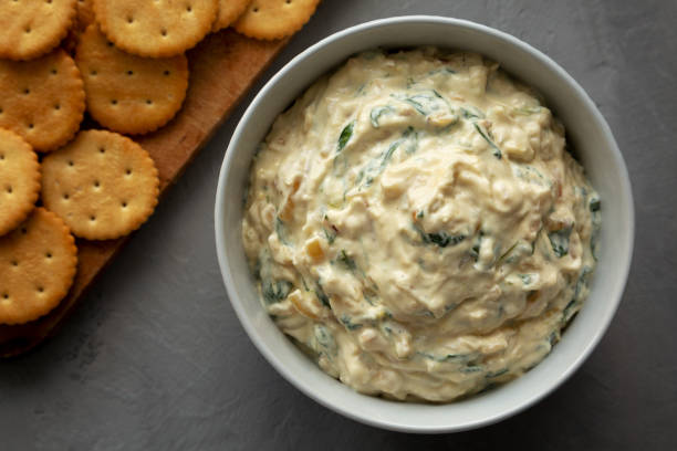istock Homemade Caramelized Onion and Spinach Dip, top view. Flat lay, overhead, from above. Close-up. 1910043318
