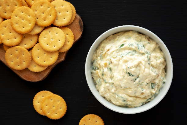 istock Homemade Caramelized Onion and Spinach Dip, top view. Flat lay, overhead, from above. 1910043706