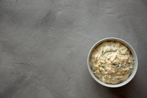 Homemade Caramelized Onion and Spinach Dip, top view. Flat lay, overhead, from above.