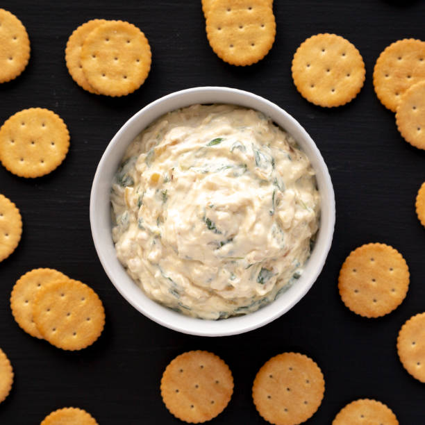 istock Homemade Caramelized Onion and Spinach Dip, top view. Flat lay, overhead, from above. 1910044764