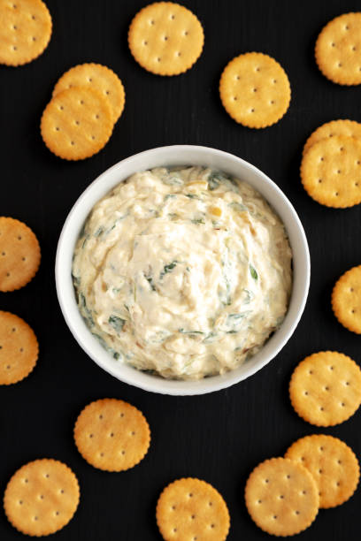 istock Homemade Caramelized Onion and Spinach Dip, top view. Flat lay, overhead, from above. 1910044775