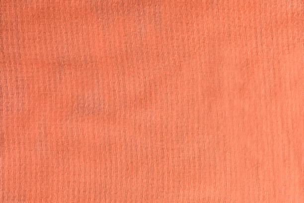 Close up of orange rubber sponge background. This file is cleaned and retouched.