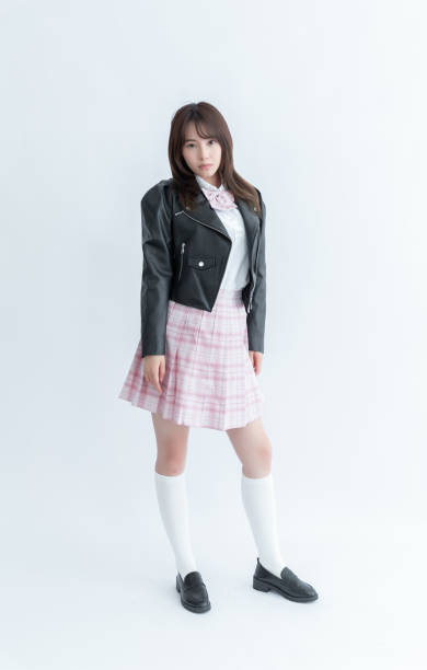 istock Asian school girl in uniform with black leather jacket 1910063143