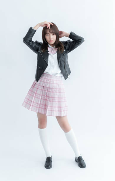 istock Asian school girl in uniform with hands on head 1910063653