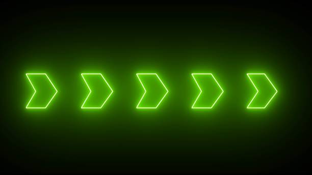 istock Neon right arrow icon. Set of green glowing neon arrow pointers on black background. 1910070400