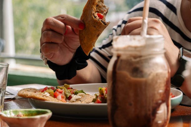 istock Person enjoying a traditional Mexican meal 1910084981