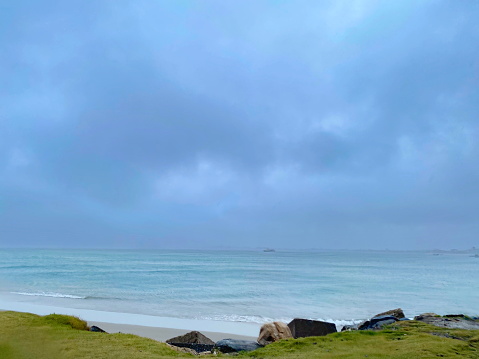 Beautiful beach landscape on a cloudy day with rain. Photo taken on Enseada beach, in beautiful São Francisco do Sul, Santa Catarina, Brazil.