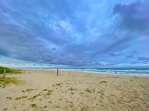 Beautiful beach landscape on a cloudy day with rain. Photo taken on Enseada beach, in beautiful São Francisco do Sul, Santa Catarina, Brazil.