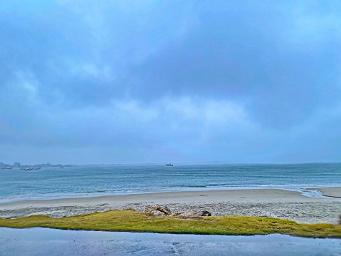 Beautiful beach landscape on a cloudy day with rain. Photo taken on Enseada beach, in beautiful São Francisco do Sul, Santa Catarina, Brazil.