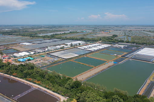 Aerial top view of metropolitan provincial waterworks industry factory in urban city town. Water utilities service.