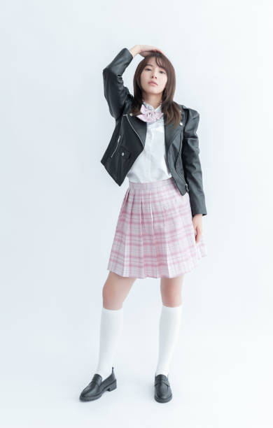 istock Asian school girl in uniform with white background 1910120237