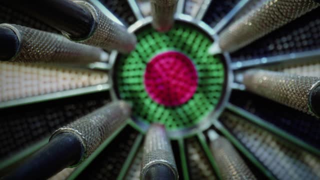 Darts in the center of dartboard - set and achieve your aspirations and goals concept stock video
