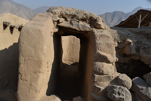 Huaycán de Cieneguilla is an Archaeological Zone, a small treasure located in the eastern part of the city of Lima.
 in foreground,Rough-hewn stones forming the entrance to an ancient passage