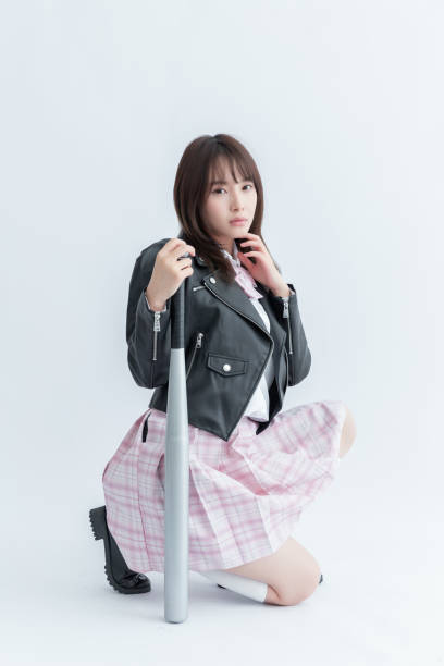 istock Asian school girl holding a bat 1910134268