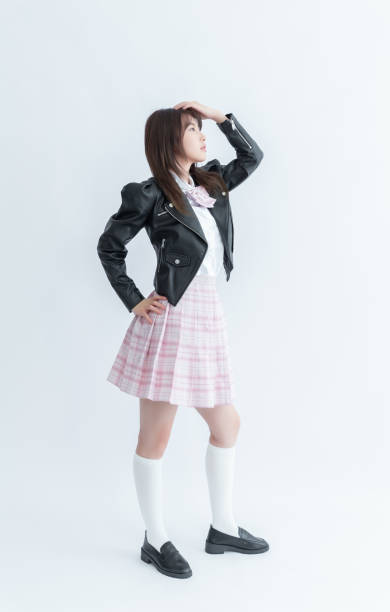 istock Asian school girl in uniform and leather jacket 1910163323
