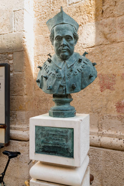 Monument to Monsignor Pompeo Sarnelli bishop in the historic center of Polignano a Mare. Polignano a Mare, Puglia, Italy - October 4, 2023: Monument to Monsignor Pompeo Sarnelli bishop in the historic center of Polignano a Mare. monsignor stock pictures, royalty-free photos & images