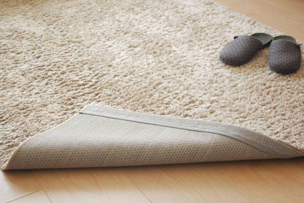 istock carpet texture background on wooden floor with copy space 1910173849