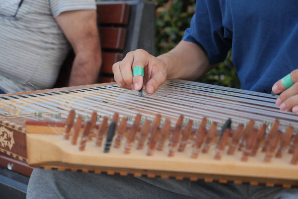 istock hands of musician playing on cimbalom or dulcimer, 1910174888