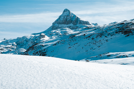 Anie peak in the french and spanish pyrenees impressive mountain. snowy mystical landscape views copy space