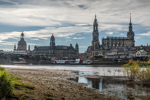 Elbe riverbank in Dresden. Skyline with famous landmarks Cathedral of the Holy Trinity or Hofkirche and Frauenkirche. Germany - Saxony