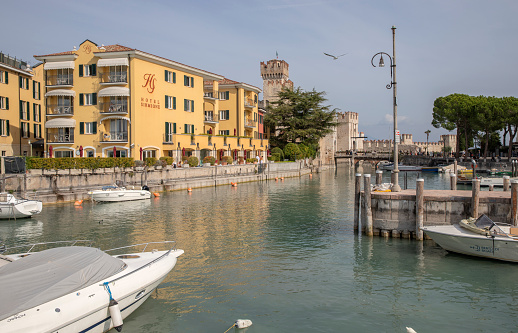 View of the fortress, port and Lake Garda in the old town of Sirmione Italy