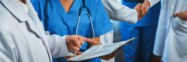 istock Confident medical staff team working together in panoramic banner. Neoteric 1910244262