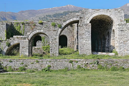 Remains of stepped arcade of four arches -in crescendo, alternately one half-sized, the next complete- made of stone block masonry on the upper-central courtyard of the fortress. Gjirokaster-Albania.