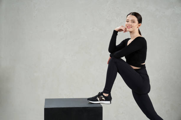 istock Smiling beautiful female trainer posing with cube during workout. 1910277277