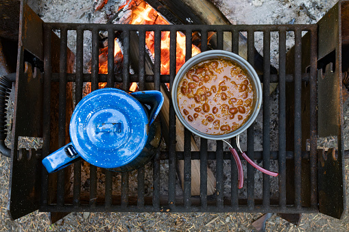 Cooking Beans and boiling water over campfire