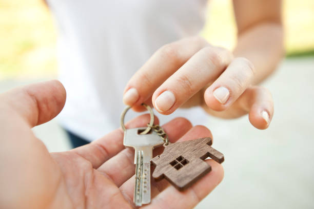 istock Keys from door in hands 1910289565