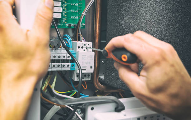 istock The man is installing the electrical equipment in the house 1910293772