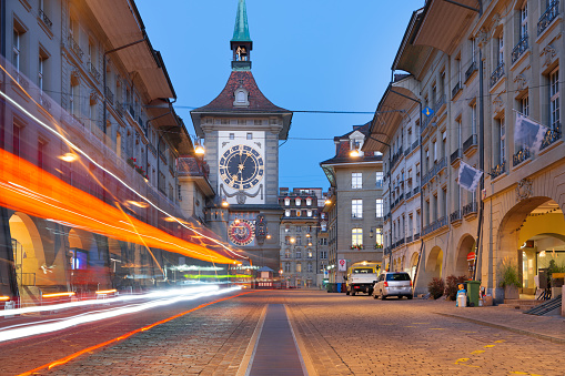 Bern, Switzerland with the Zytglogge clock tower and blue hour traffic.