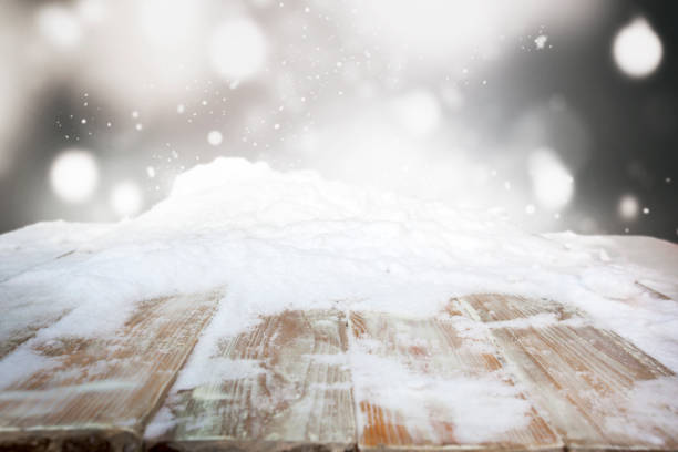 istock Wooden desk covered by snow 1910304271