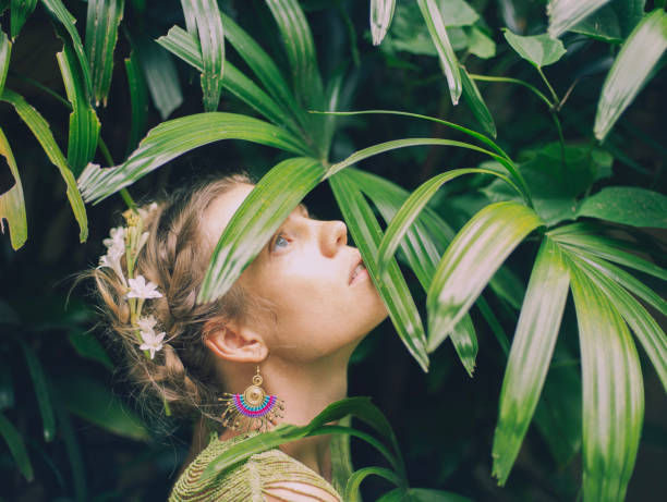istock young woman merges with nature 1910306386